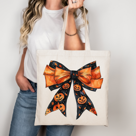 Halloween Tragetasche mit Kürbisschleife – Baumwollbeutel 38x42 cm mit langen Henkeln – Bügelbild auch für T-Shirts, Kissen & Jacken – Geschenkidee für Halloweenfans