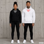FRECHHEIT SIEGT. – Hoodie mit Frontprint, Frau in Schwarz und Mann in Weiß vor Betonwand