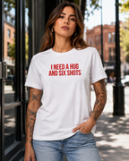 I NEED A HUG AND SIX SHOTS – besticktes Damen Shirt, lustiges Statement T-Shirt, Geschenk für Freundin, Bio-Baumwolle, Weiß oder Schwarz