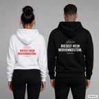 Leise rieselt mein Nervenkostüm – Hoodie mit Backprint, Frau in Weiß mit rotem und Mann in Schwarz mit weißem Aufdruck