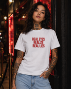 REAL EYES REALIZE REAL LIES – besticktes Damen Shirt, Statement T-Shirt, frecher Spruch, Geschenk für Freundin, Bio-Baumwolle, Weiß oder Schwarz