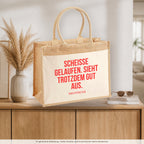 Scheisse gelaufen. Sieht trotzdem gut aus. – Jutetasche mit Spruch, auf dem Sideboard im Flur