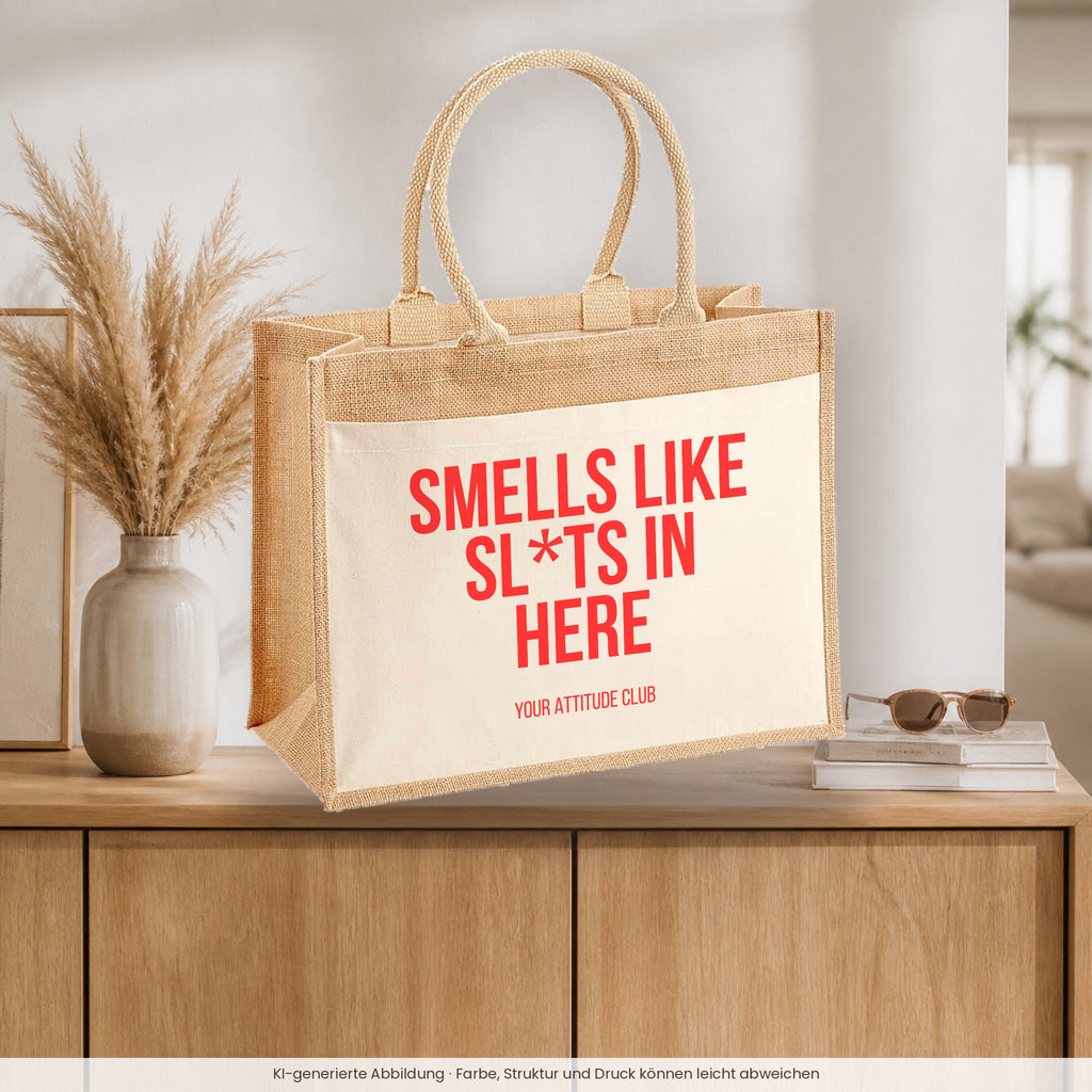 Smells like sl*ts in here – Jutetasche mit Spruch, auf dem Sideboard im Flur