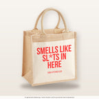 Smells like sl*ts in here – Jutetasche mit Spruch, mittlere Jutetasche 30 × 30 cm