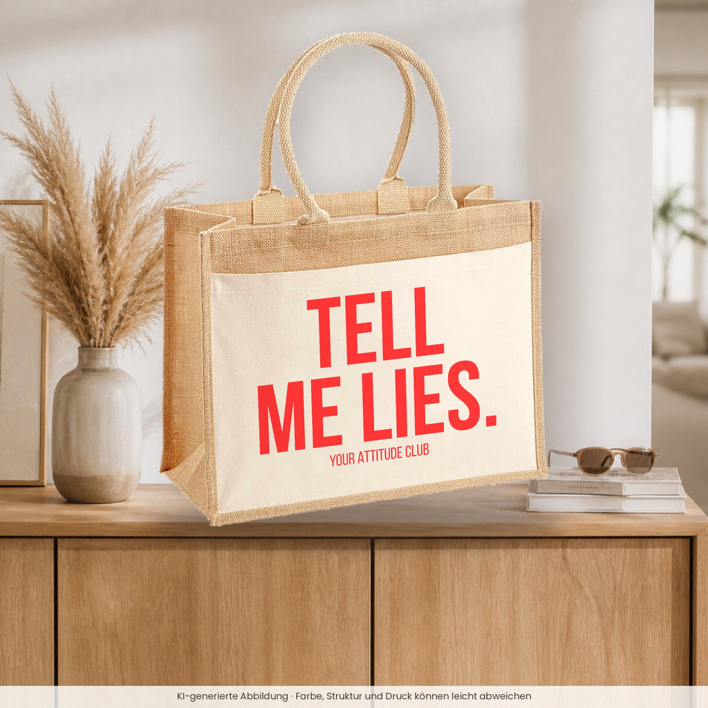 Tell me lies. – Jutetasche mit Spruch, auf dem Sideboard im Flur