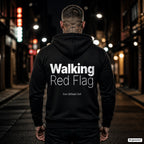 Walking Red Flag – schwarzer Hoodie mit weißem Backprint, Herren in der Stadt bei Nacht