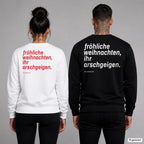 Fröhliche Weihnachten, ihr Arschgeigen – Weihnachtspullover mit Backprint, Frau in Weiß mit rotem und Mann in Schwarz mit weißem Aufdruck